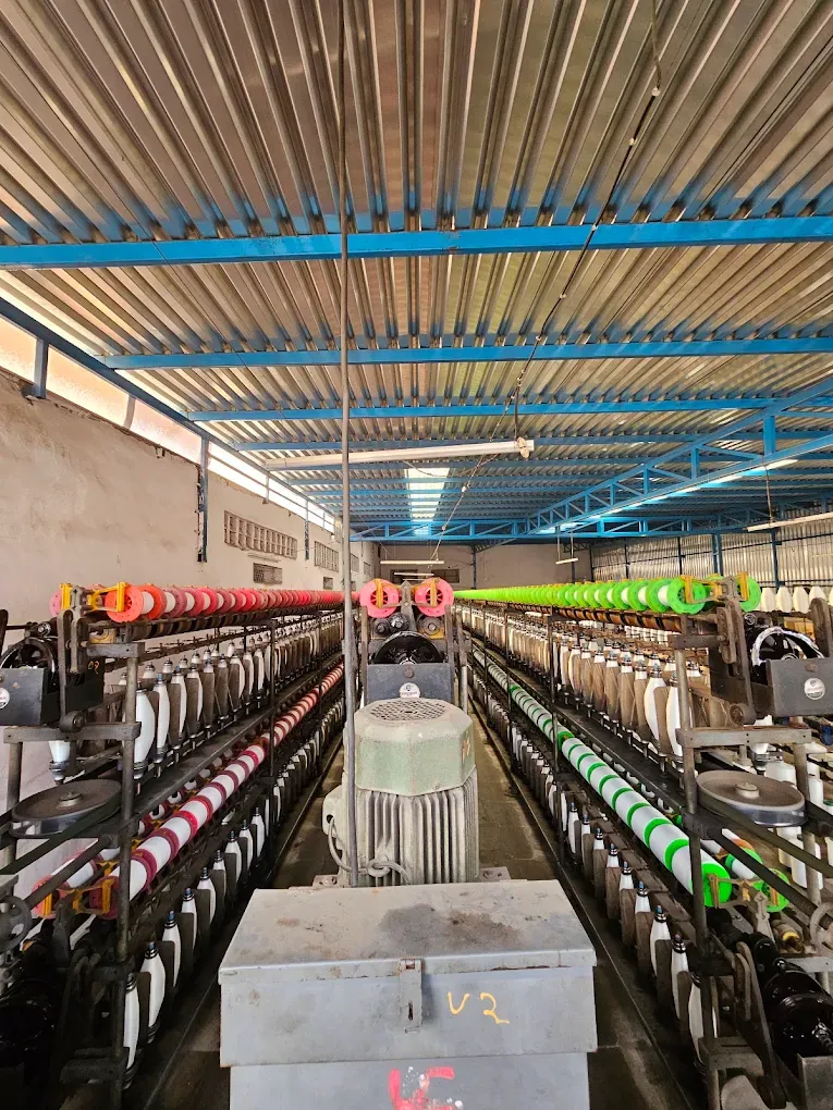 Rows of thread lines and textile machines at Bindiya Textile